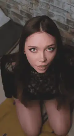woman licking lips looking up