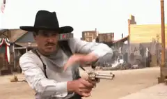 Man in cowboy hat firing revolver