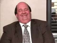 Man in suit smiling and nodding