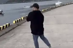 Man fishing loses balance and falls