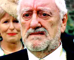 Old man crying and wiping tears