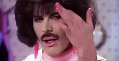 Freddie Mercury winking and sticking tongue out