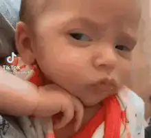 Baby with skeptical side-eye
