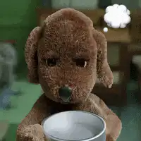 Brown stuffed dog with thought bubble