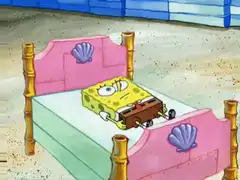 SpongeBob lying in bed with a brown box