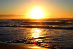 sunset over ocean waves
