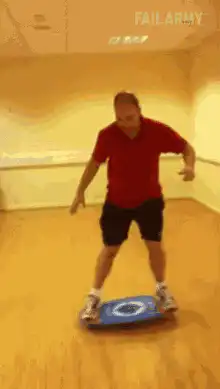 Man falls off balance board