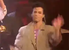 Man singing and dancing on stage