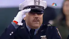 Officer Ted saluting