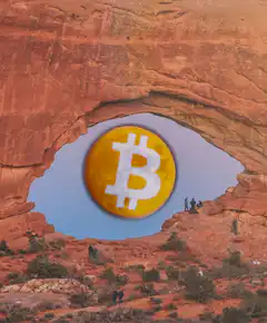 Bitcoin coin in natural rock arch