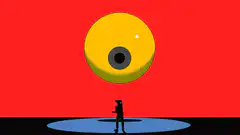 Silhouette looking at giant yellow eye