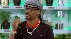 Snoop Dogg eating something delicious