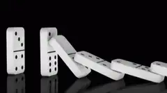 Dominoes falling in a chain reaction