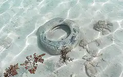 Toilet in shallow ocean water