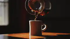 Pouring tea into a mug