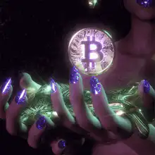 Glowing Bitcoin in hands