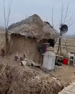 Man in hut with loudspeaker cuts to Chris Evans
