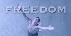 Man in rain with freedom text