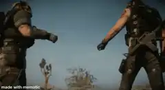 Two soldiers fist bump in desert