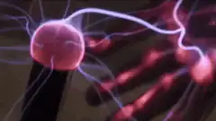 hand touching plasma ball