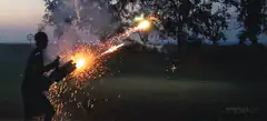 Person shooting fireworks from a hose