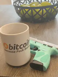 Bitcoin mug and green gun