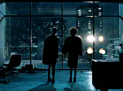 Silhouettes watching city fireworks