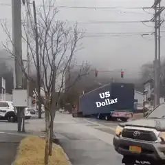 Train hits truck labeled US Dollar