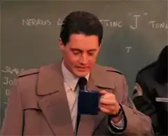 Agent Cooper sips coffee