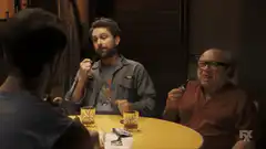 Men smoking pipes at a table