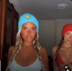 Two women in beanies and a man reacting