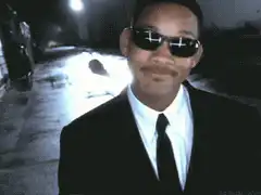 Will Smith pointing gun at camera