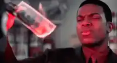 Mr. Shortee holding a burning bag of weed