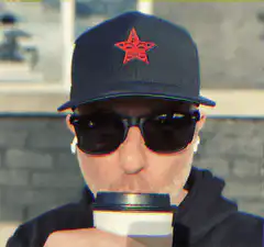 Man in cap drinking coffee
