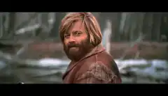 Dwight Schrute smirking in the woods