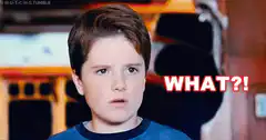 Boy looking confused with WHAT text