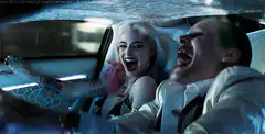 Harley Quinn and Joker laughing in car