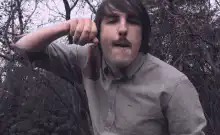 Man holding a severed head