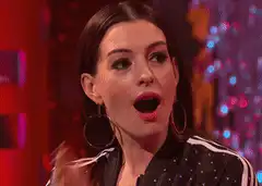 Anne Hathaway shocked and covers mouth
