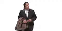 John Travolta holding coat and shrugging