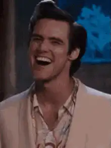 Jim Carrey laughing and giving a thumbs up