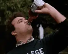 Man chugs beer and throws bottle