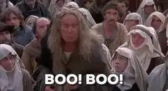 Man in crowd yelling BOO BOO