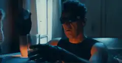 Man drinks chicks from glass