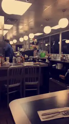 Alien mannequin in a diner