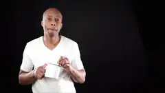Man sips coffee and smiles