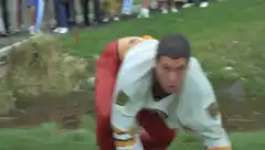 Golf fan tackles caddy and rolls down hill