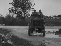 WWI truck driving on muddy road