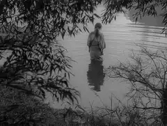 Woman standing in river