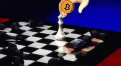 Hand placing Bitcoin on chess piece